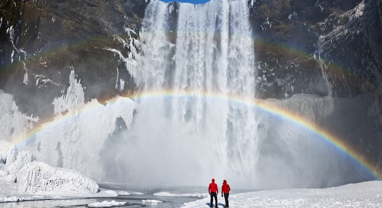 Couple under a rainbow by a large waterfall, winter. Skogafoss, Iceland.
173070430
awe, enjoyment, majestic, scale, romantic
Waterfall and rainbow with couple - stock photo
Couple under a rainbow by a large waterfall, winter. Skogafoss, Iceland © Jeremy Walker / Getty