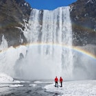 Couple under a rainbow by a large waterfall, winter. Skogafoss, Iceland.
173070430
awe, enjoyment, majestic, scale, romantic
Waterfall and rainbow with couple - stock photo
Couple under a rainbow by a large waterfall, winter. Skogafoss, Iceland © Jeremy Walker / Getty